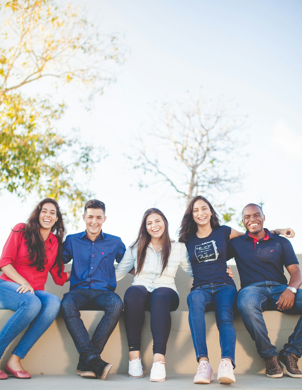 A diverse group of community members smiling together